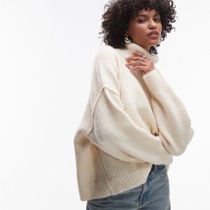 Topshop cream exposed hem turtleneck